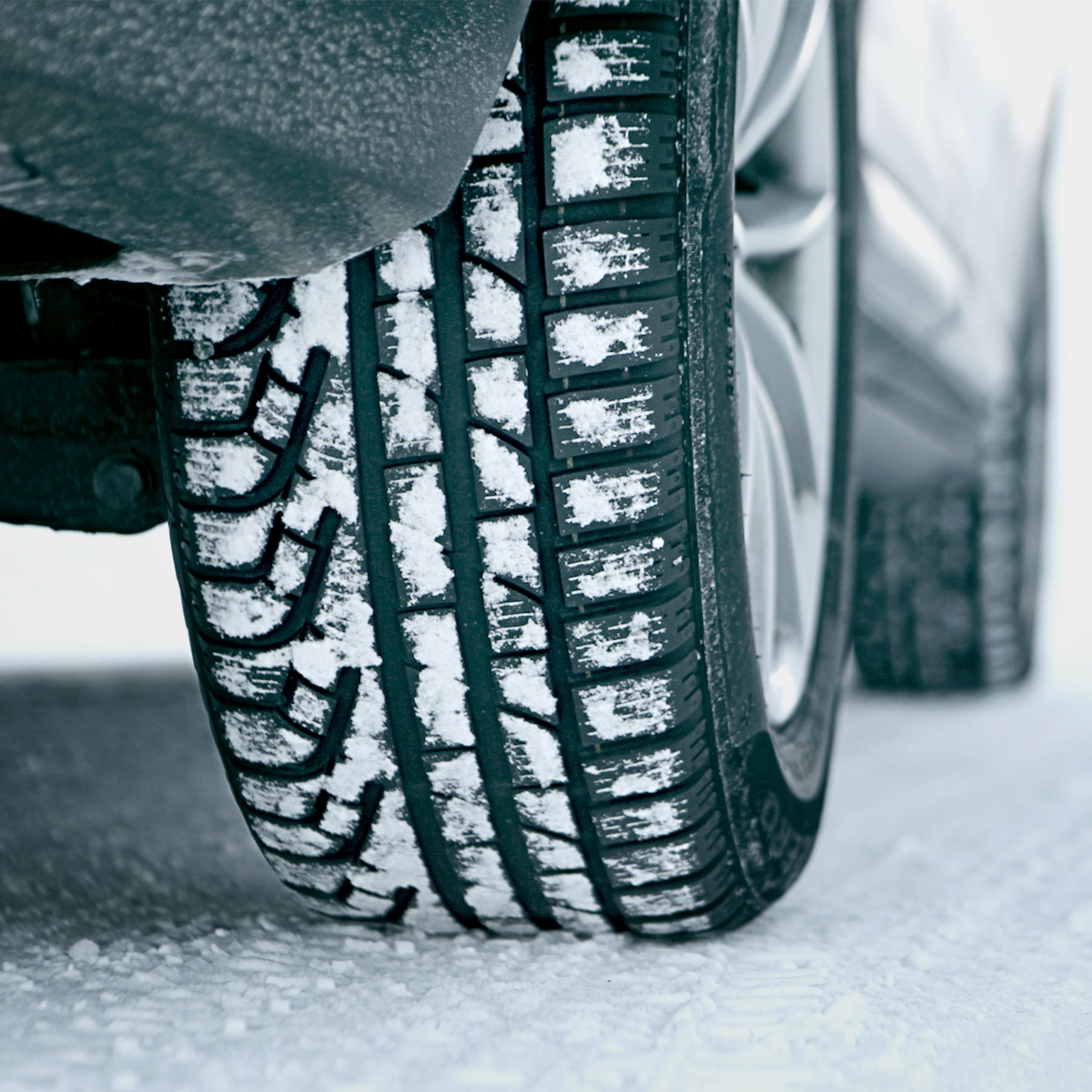 Winter tyres with treads in snow